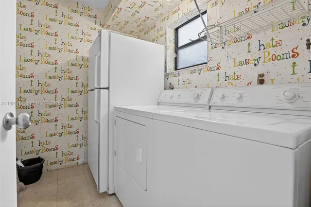 a view of staircase with wooden floor and white walls