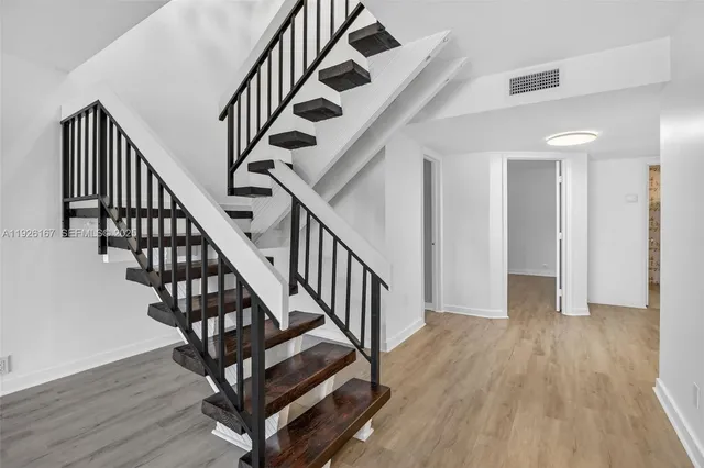 a view of a hallway with windows