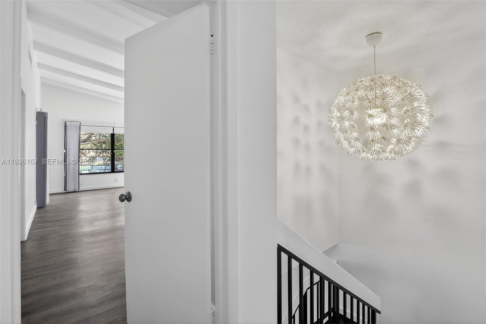 9703 North New River Canal Road, Unit 103 Plantation, FL 33324 - Photo 18 of 32 a view of a hallway with windows