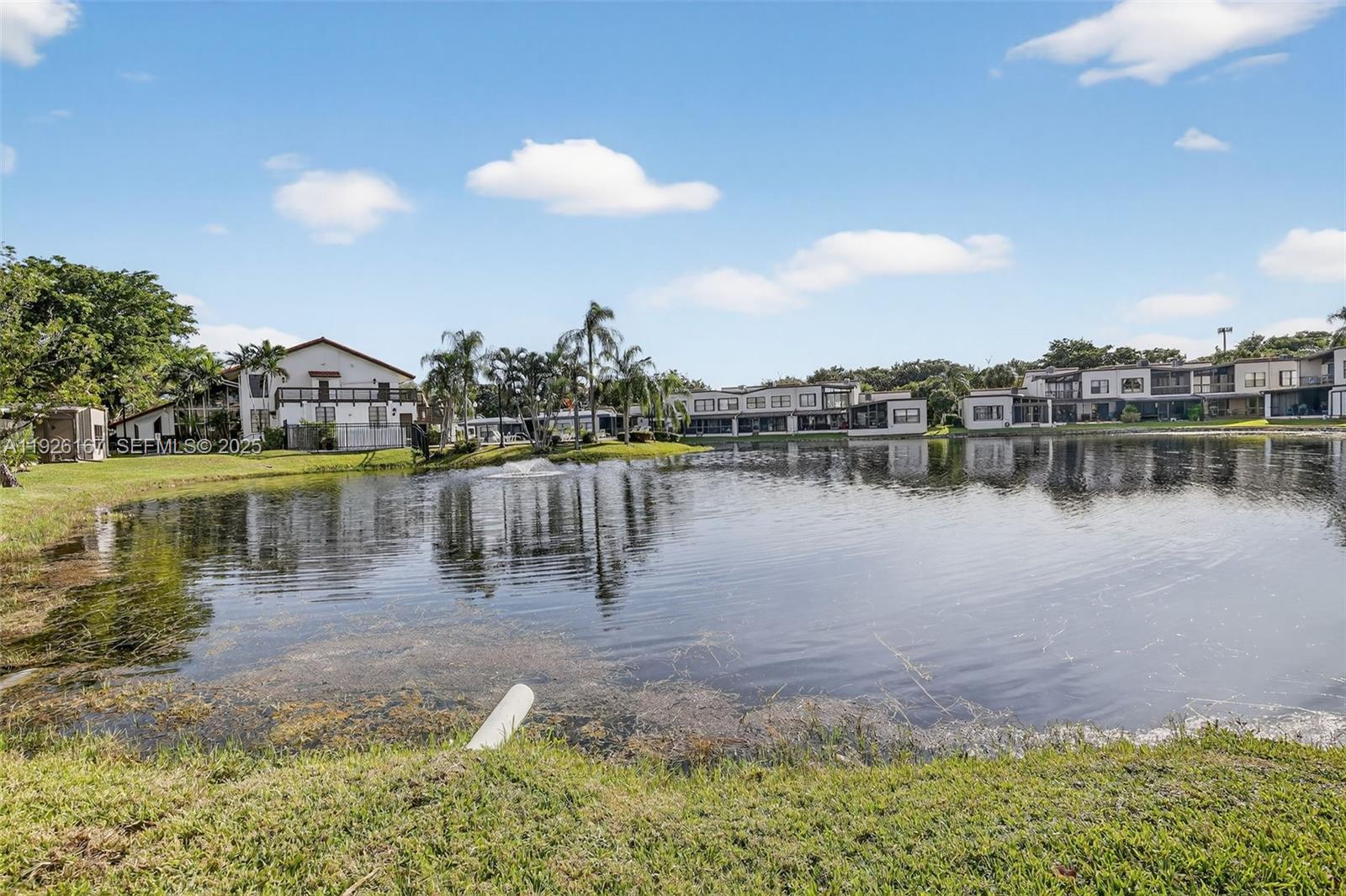9703 North New River Canal Road, Unit 103 Plantation, FL 33324 - Photo 29 of 32 a view of a lake with houses in the back