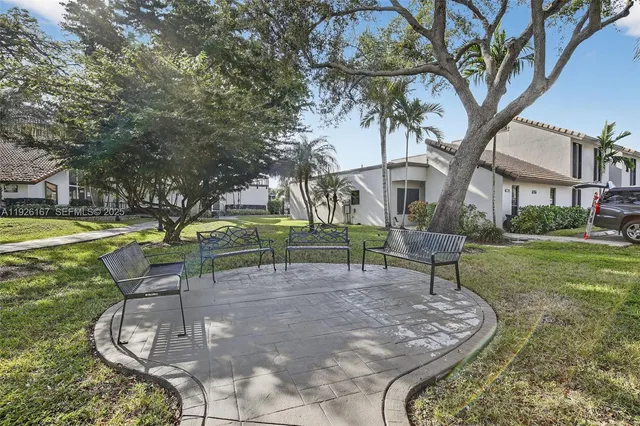 a view of pathway with a yard