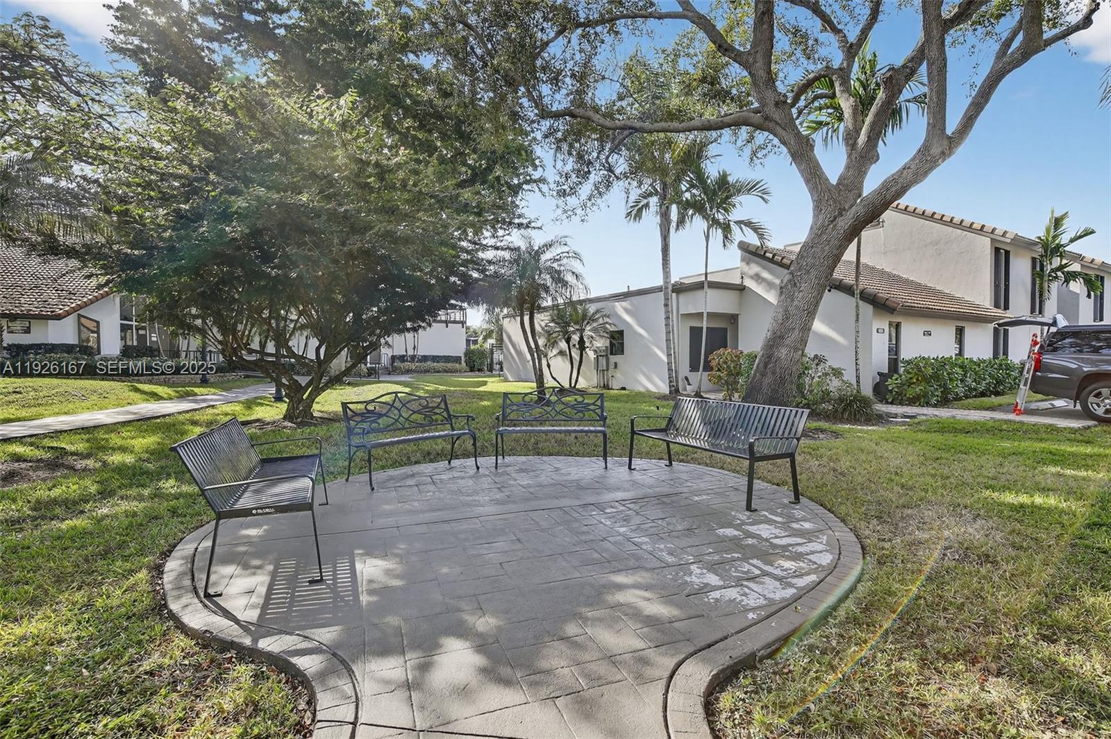 9703 North New River Canal Road, Unit 103 Plantation, FL 33324 - Photo 31 of 32 a garden view with a sitting space