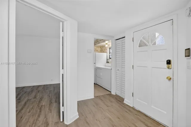 a view of a bathroom with wooden floor