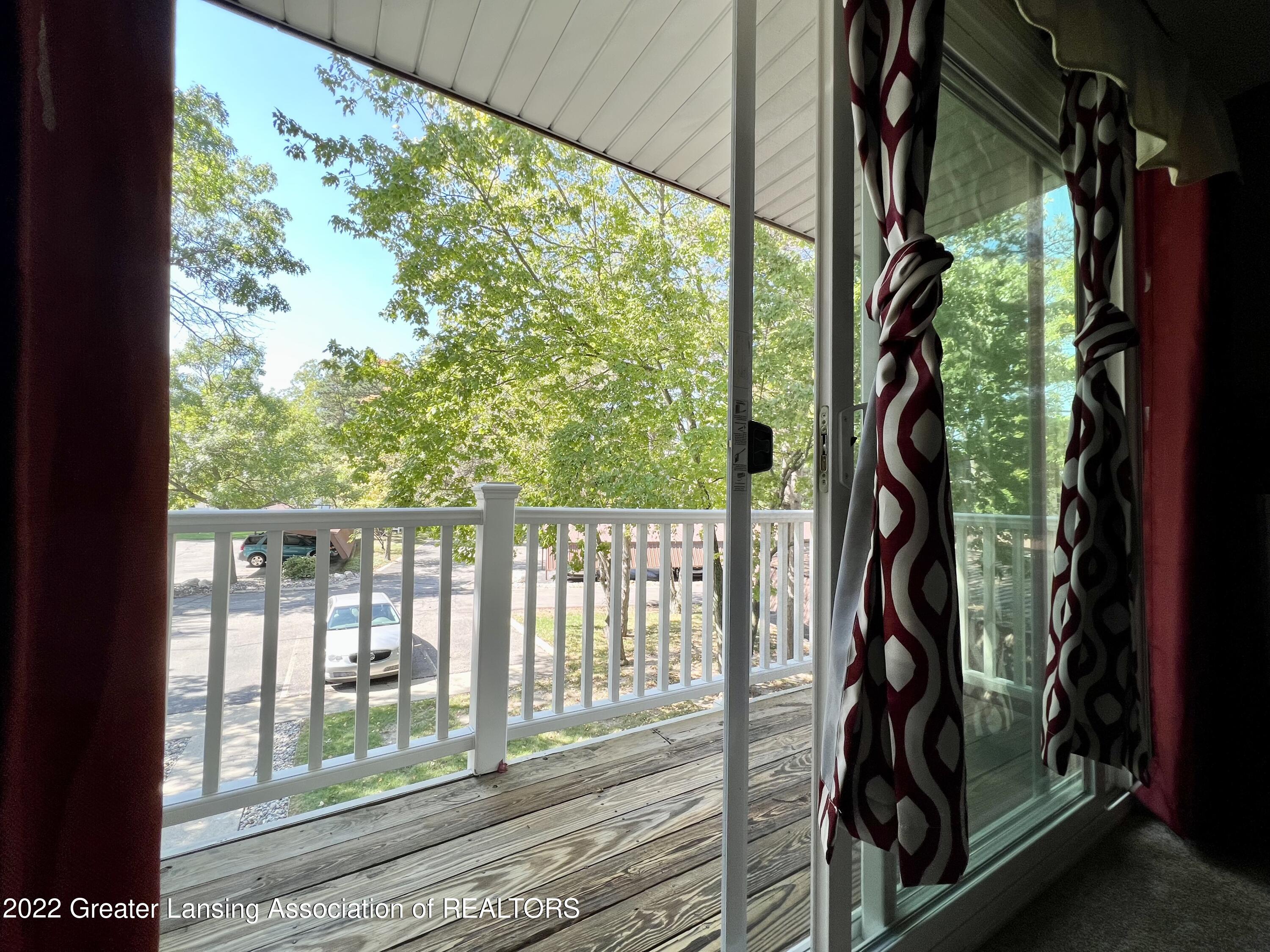 2024 Hamilton Road, Unit 206 Okemos, MI 48864 - Photo 26 of 29 26 Dining room large balcony view