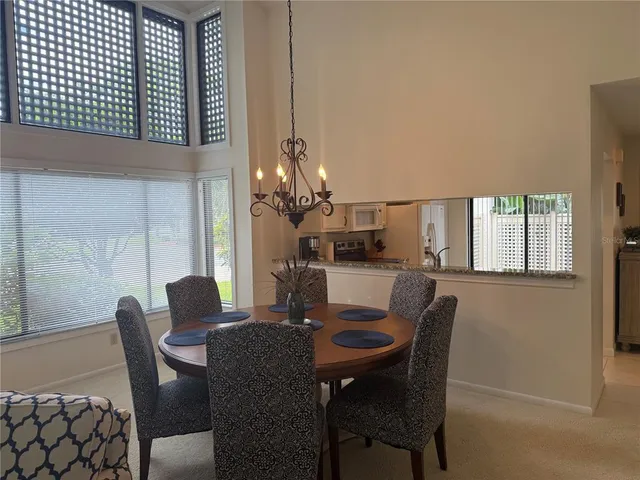 a dining room with furniture and window