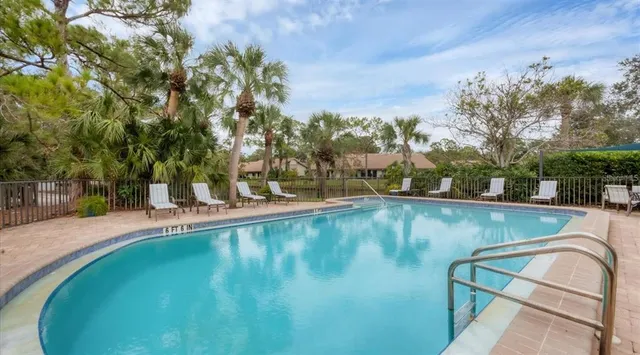 a view of a swimming pool with a yard