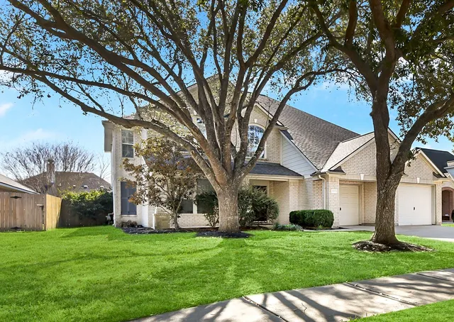 a white bath tub sitting next to a white toilet