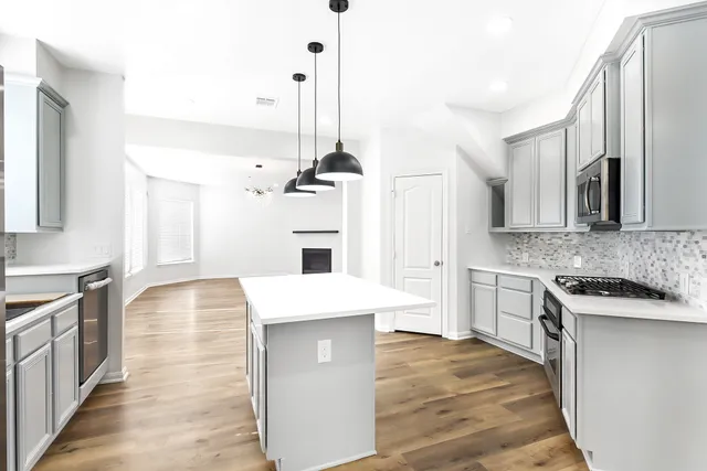a kitchen with a sink and cabinets