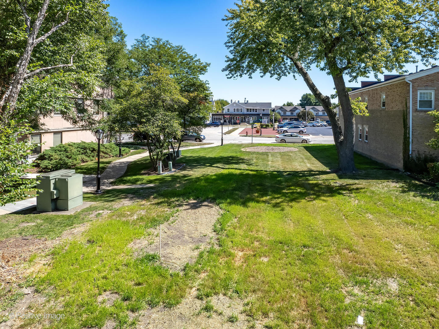 100 South Walnut Street Itasca, IL 60143 - Photo 4 of 8 a view of yard with swimming pool and green space