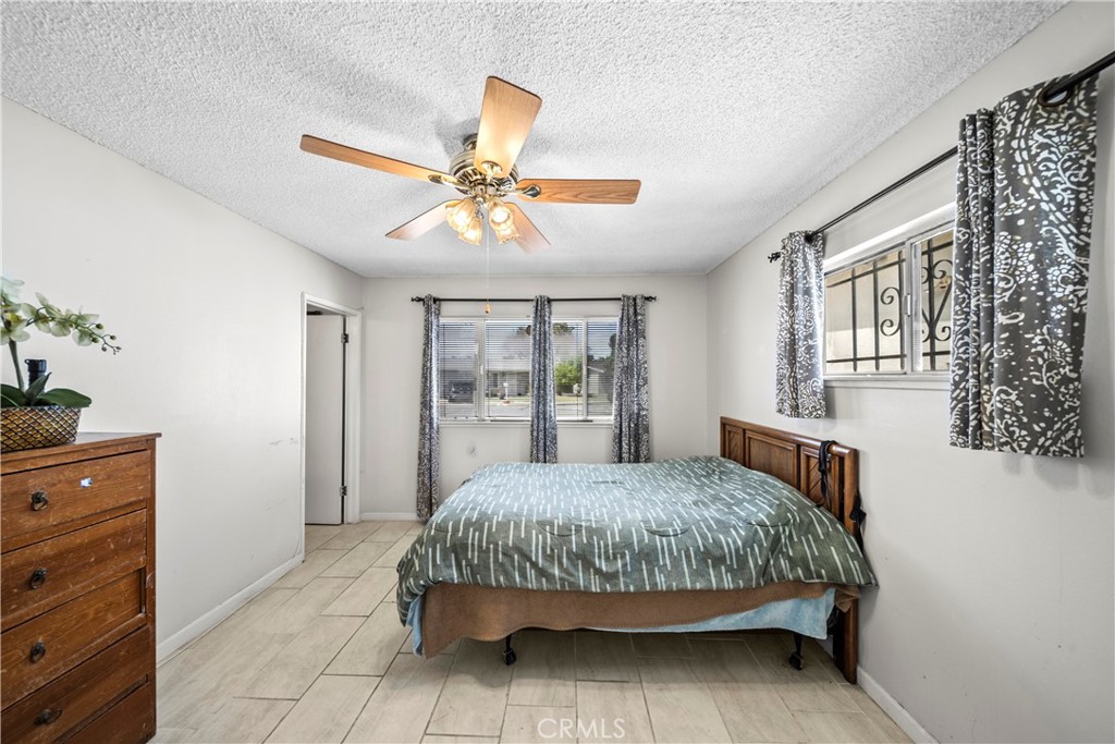 820 South Alessandro Street Hemet, CA 92543 - Photo 15 of 37 a bedroom with a bed dresser and a window