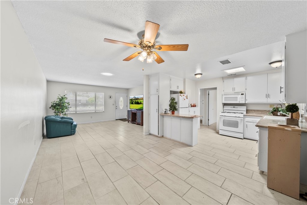 820 South Alessandro Street Hemet, CA 92543 - Photo 23 of 37 a view of kitchen with furniture and refrigerator