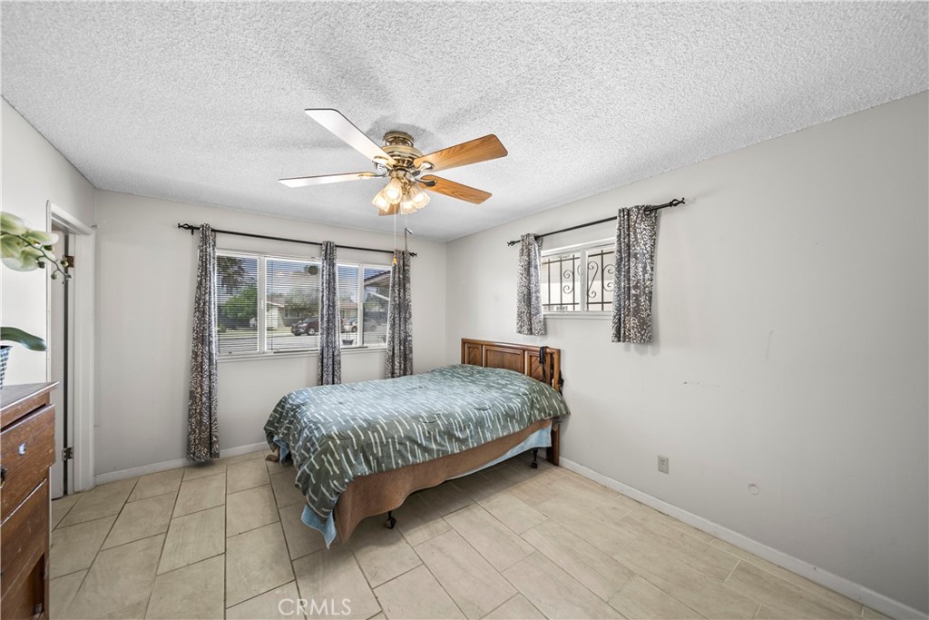 820 South Alessandro Street Hemet, CA 92543 - Photo 26 of 37 a room with a bed and a chandelier