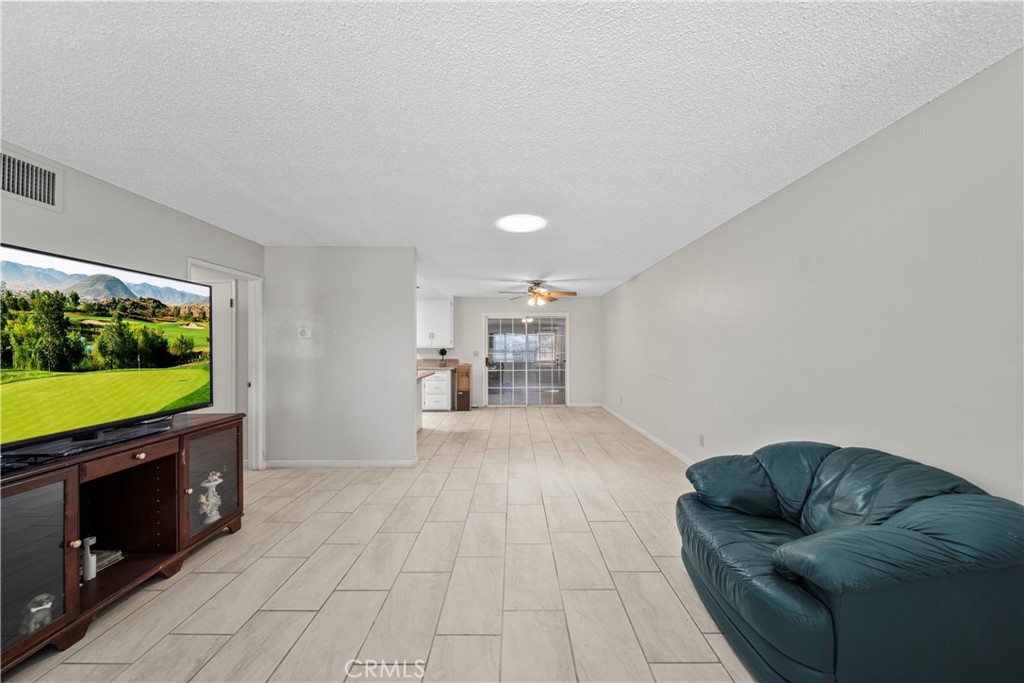 820 South Alessandro Street Hemet, CA 92543 - Photo 29 of 37 a living room with furniture and a flat screen tv