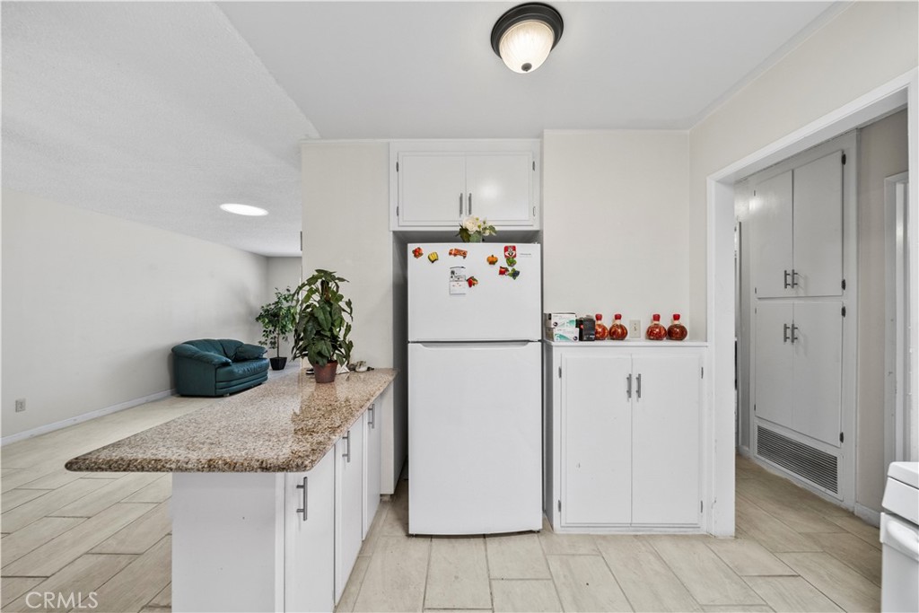 820 South Alessandro Street Hemet, CA 92543 - Photo 5 of 37 a white refrigerator freezer sitting in a kitchen