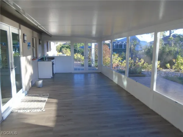 a view of a porch and dining room