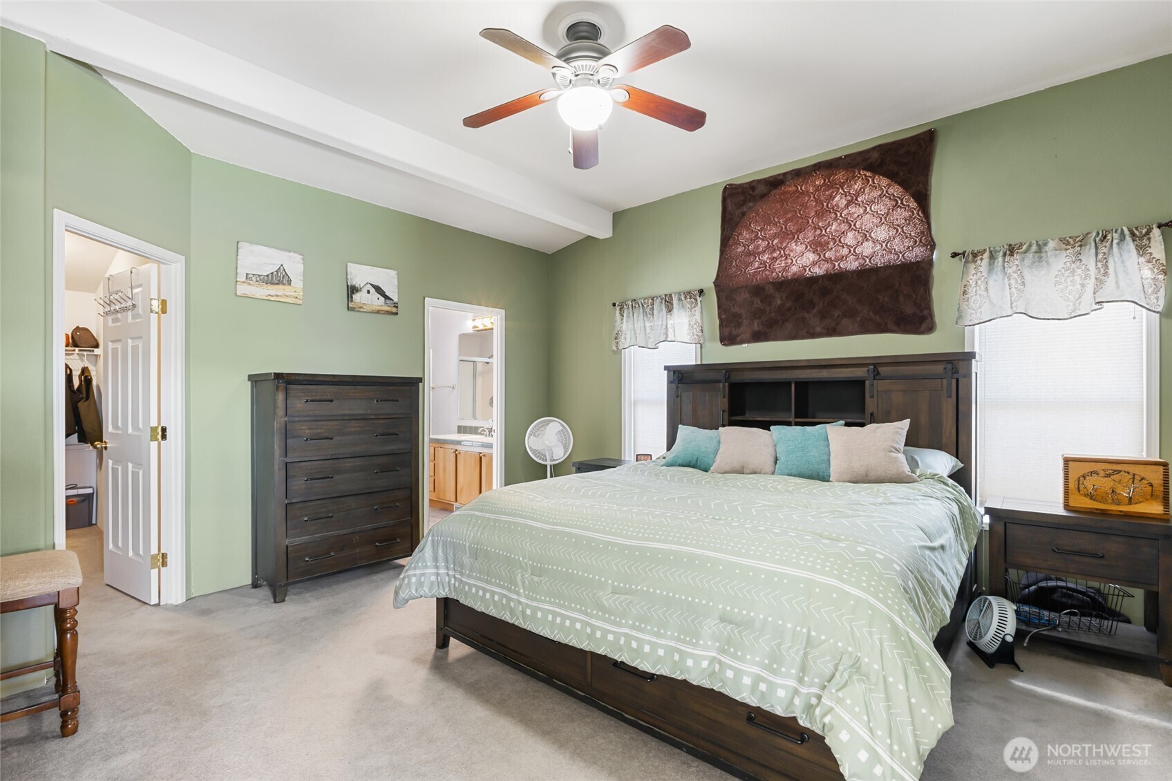 12455 Dodson Road Northwest Ephrata, WA 98823 - Photo 11 of 40 a bedroom with a bed and a chandelier