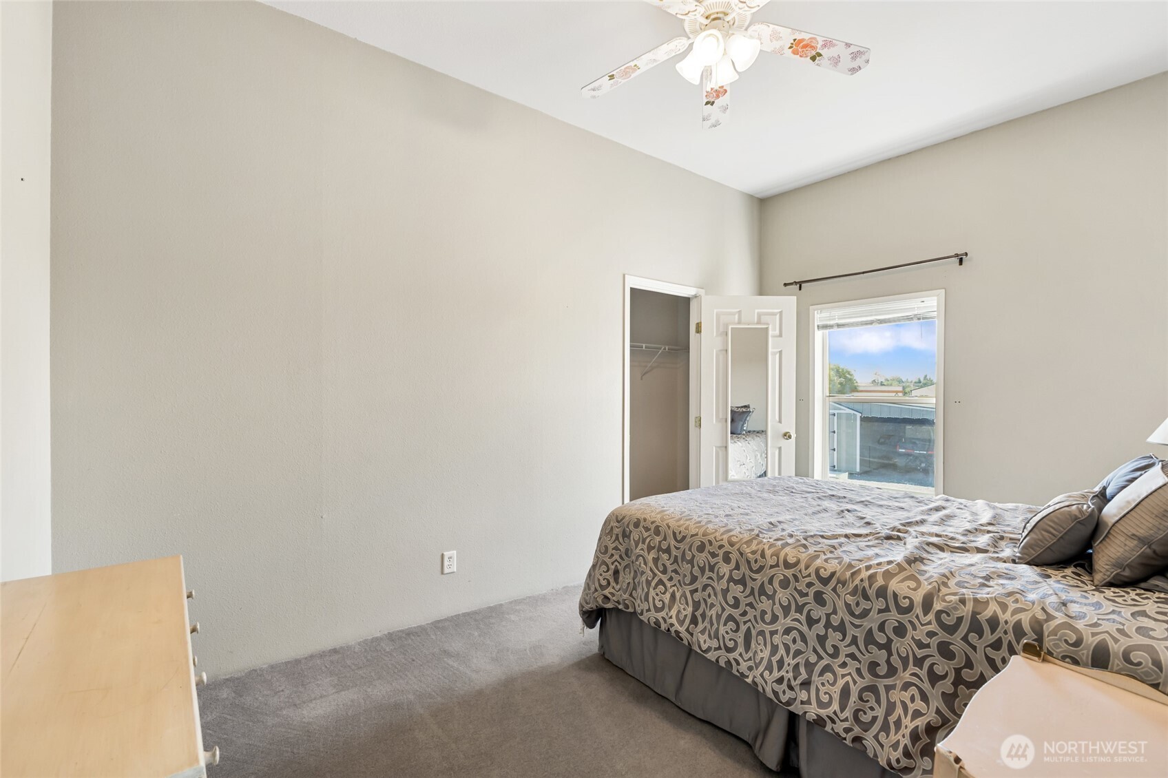 12455 Dodson Road Northwest Ephrata, WA 98823 - Photo 20 of 40 a bedroom with a bed and a chandelier