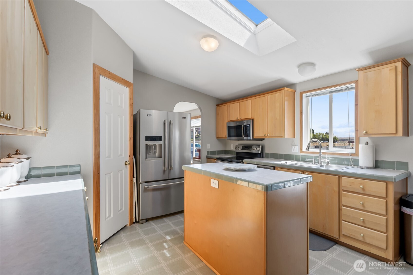 12455 Dodson Road Northwest Ephrata, WA 98823 - Photo 9 of 40 a kitchen with cabinets stainless steel appliances a sink and a window