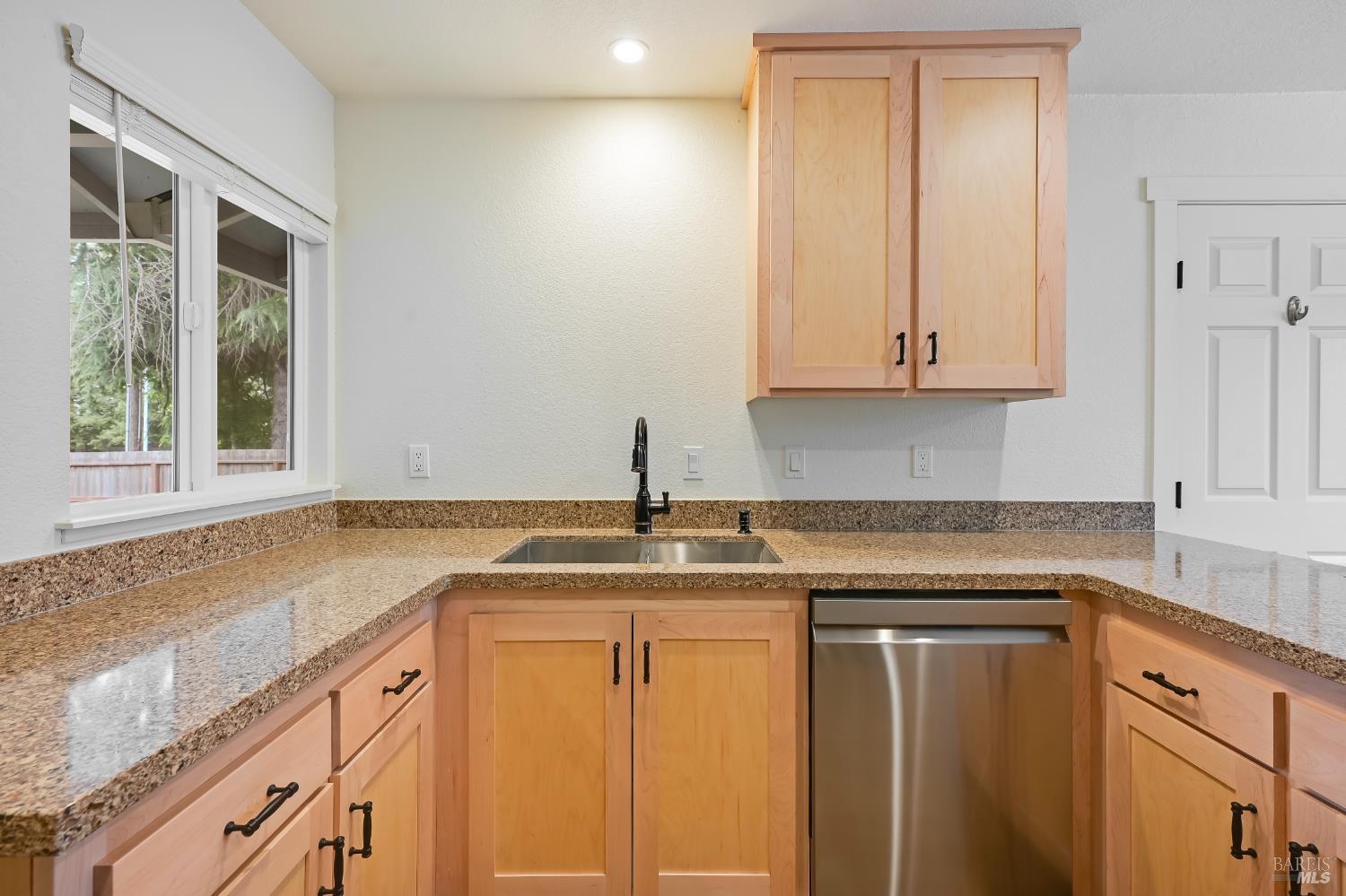 1536 Marlow Road Santa Rosa, CA 95401 - Photo 4 of 21 a kitchen with granite countertop cabinets sink and window