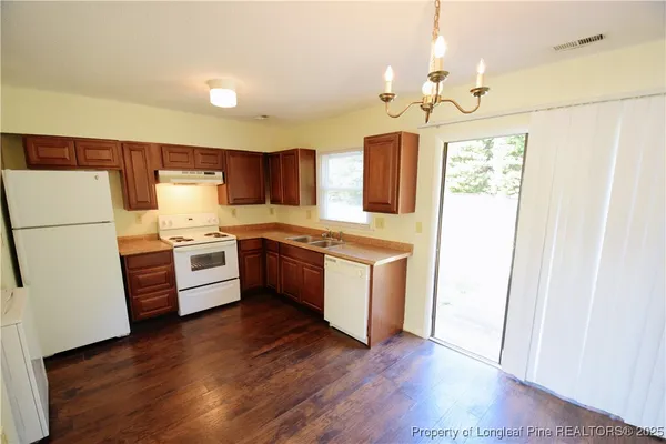 a kitchen with stainless steel appliances a refrigerator and a stove