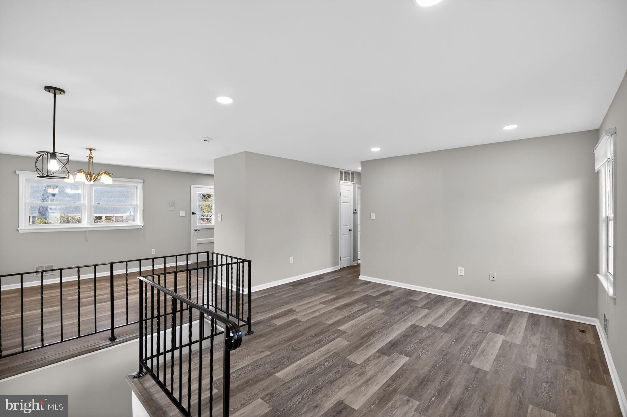 8012 Frye Road Alexandria, VA 22309 - Photo 13 of 40 a view of an empty room with wooden floor and a window