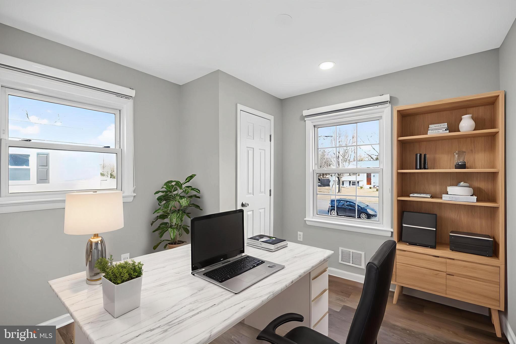 8012 Frye Road Alexandria, VA 22309 - Photo 22 of 40 a view of a workspace with furniture and a potted plant