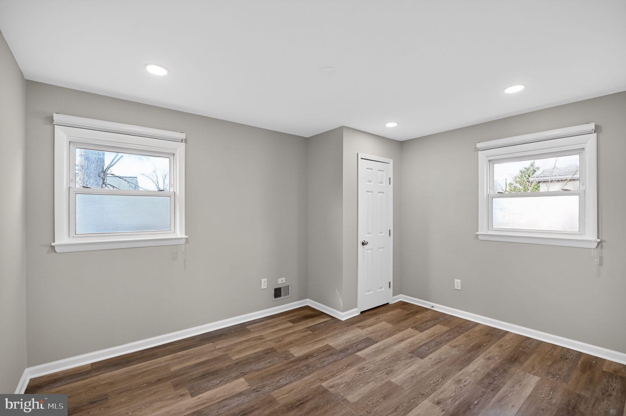 8012 Frye Road Alexandria, VA 22309 - Photo 23 of 40 a view of empty room with wooden floor and fan
