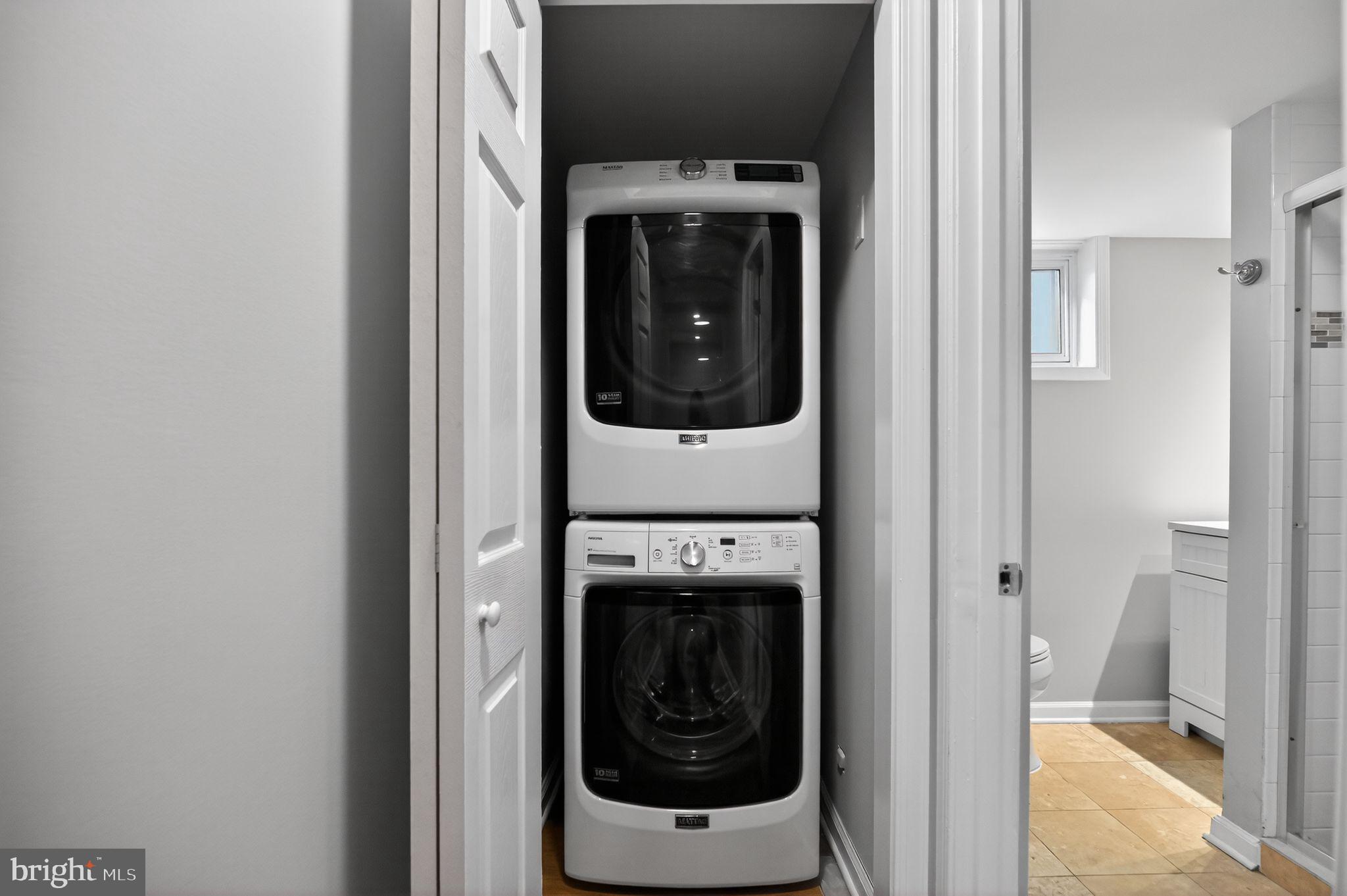 8012 Frye Road Alexandria, VA 22309 - Photo 32 of 40 a view of a hallway with washer and dryer