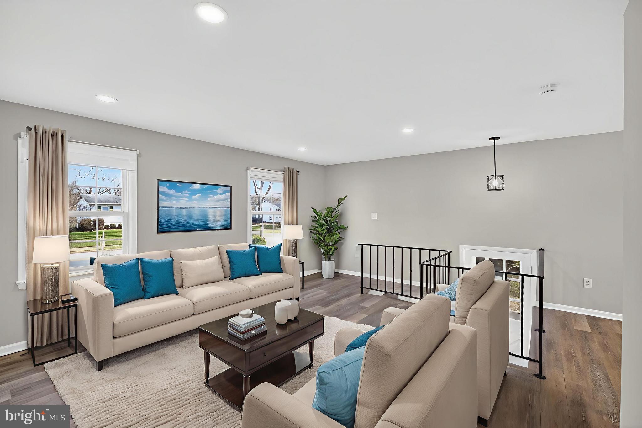 8012 Frye Road Alexandria, VA 22309 - Photo 9 of 40 a living room with furniture and a wooden floor