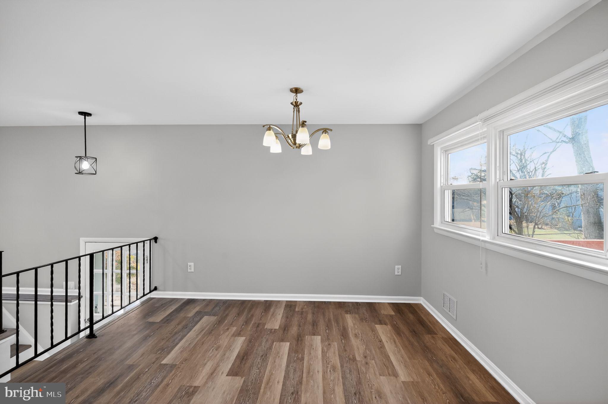 8012 Frye Road Alexandria, VA 22309 - Photo 10 of 40 wooden floor in an empty room with a window