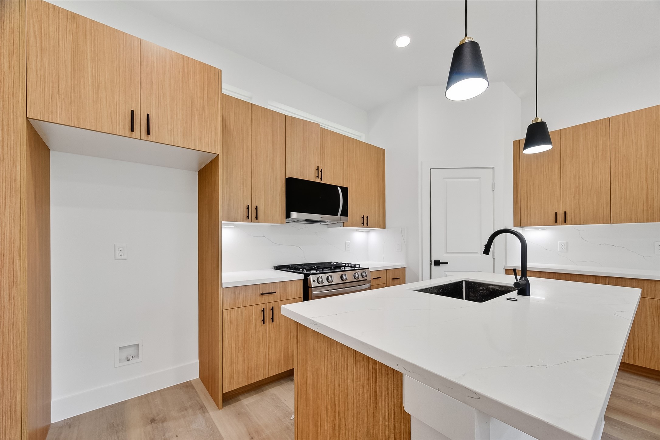 3315 Nettleton Street Houston, TX 77004 - Photo 13 of 38 a kitchen with a sink a stove and cabinets