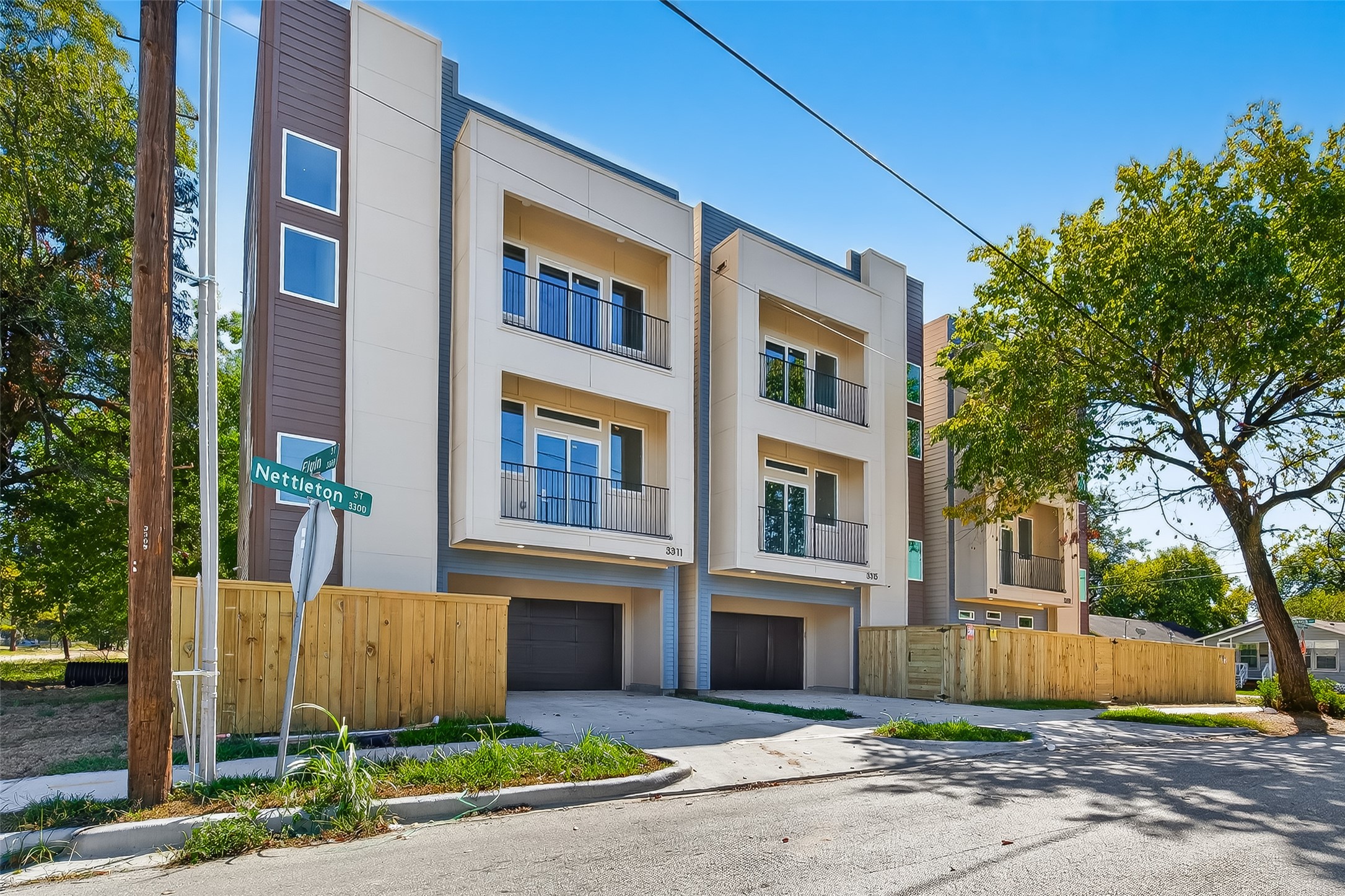 3315 Nettleton Street Houston, TX 77004 - Photo 36 of 38 a front view of a residential apartment building with a yard