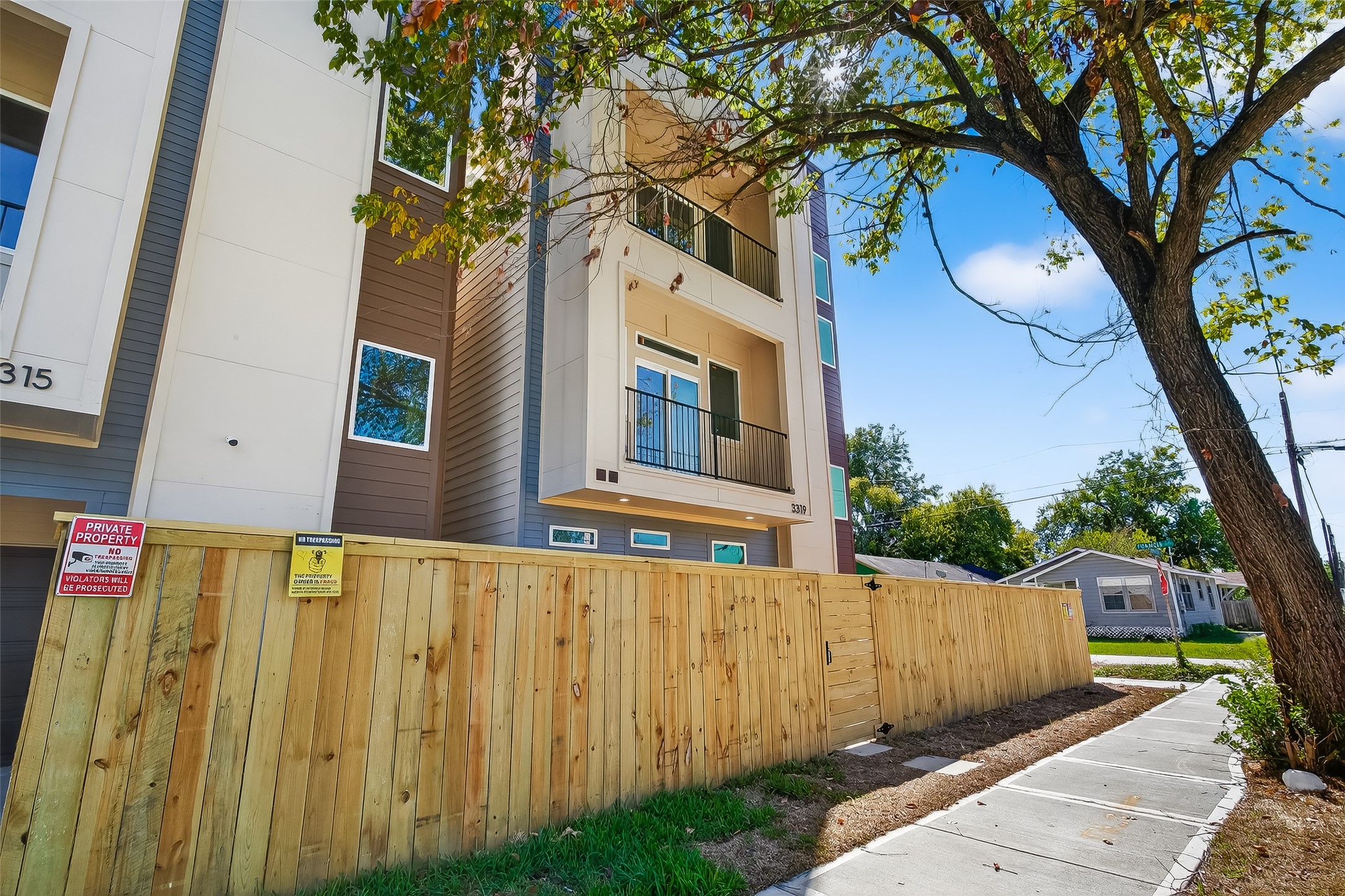 3315 Nettleton Street Houston, TX 77004 - Photo 37 of 38 a view of a house with a tree and wooden fence