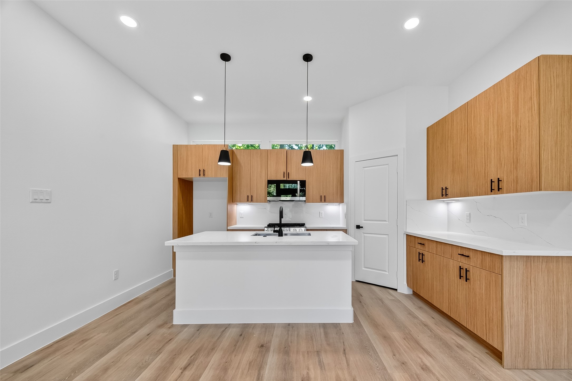 3315 Nettleton Street Houston, TX 77004 - Photo 10 of 38 a kitchen with a sink cabinets and wooden floor