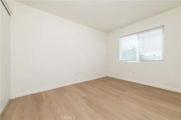 an empty room with wooden floor