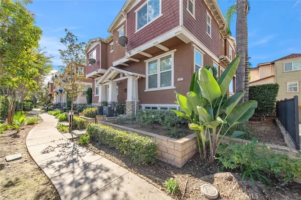 a view of a building with a yard