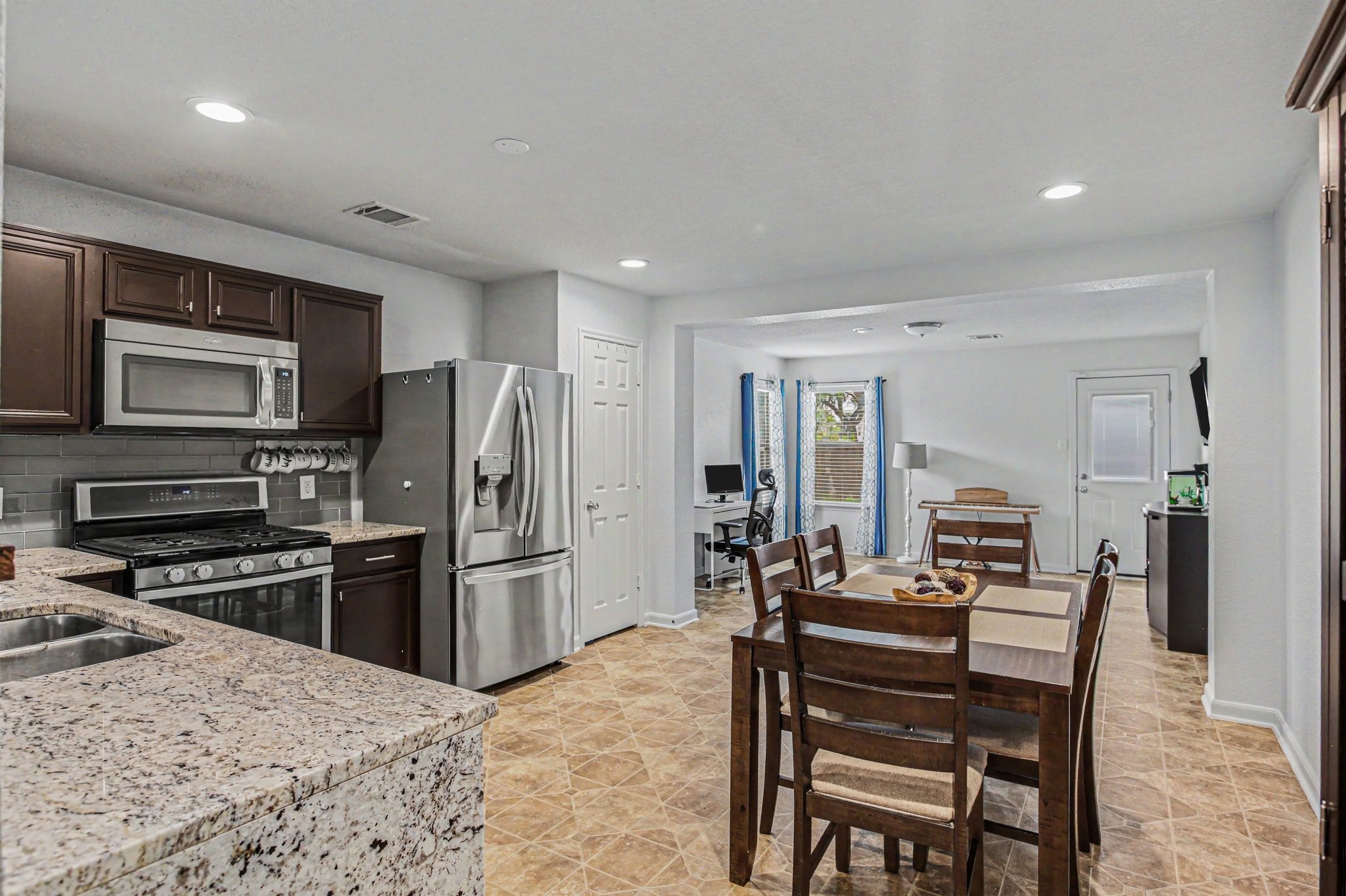 2903 Swift Brook Glen Way Spring, TX 77389 - Photo 13 of 30 Kitchen opens up to the flex space.
