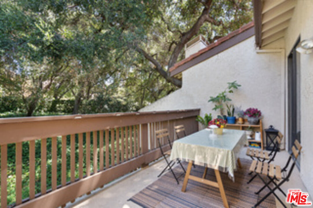 1114 Las Riendas Way Pasadena, CA 91107 - Photo 16 of 20 a view of deck with furniture and trees in the front