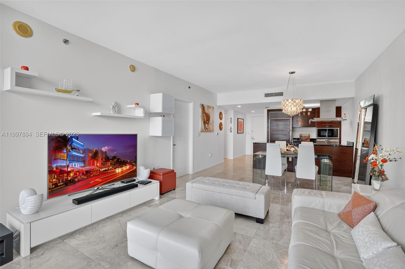 495 Brickell Avenue, Unit 2807 Miami, FL 33131 - Photo 11 of 23 a living room with furniture and a flat screen tv