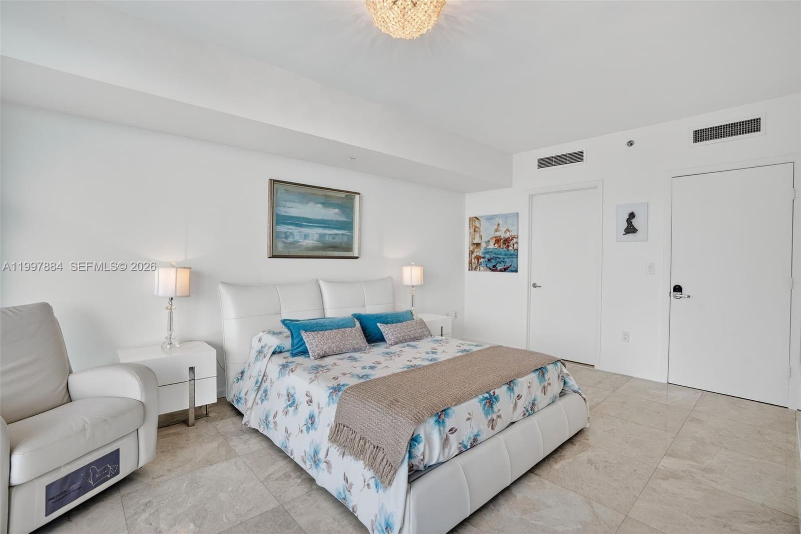 495 Brickell Avenue, Unit 2807 Miami, FL 33131 - Photo 14 of 23 a bedroom with a bed and a couch