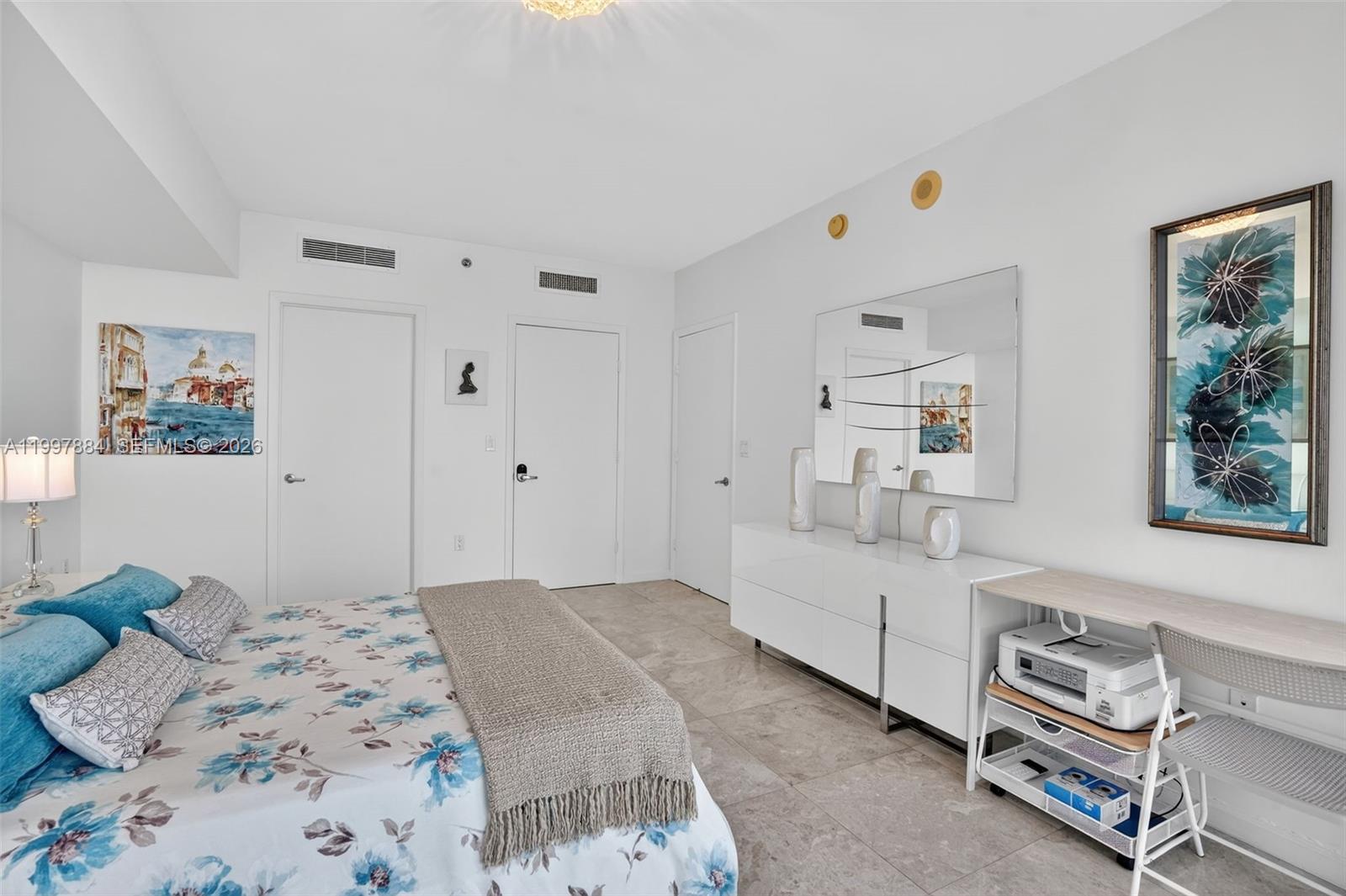 495 Brickell Avenue, Unit 2807 Miami, FL 33131 - Photo 15 of 23 a bedroom with a bed and a couch