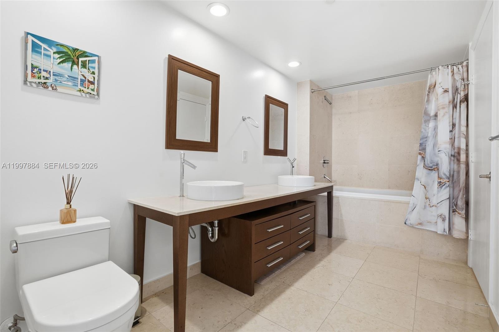 495 Brickell Avenue, Unit 2807 Miami, FL 33131 - Photo 17 of 23 a bathroom with a sink a toilet and shower