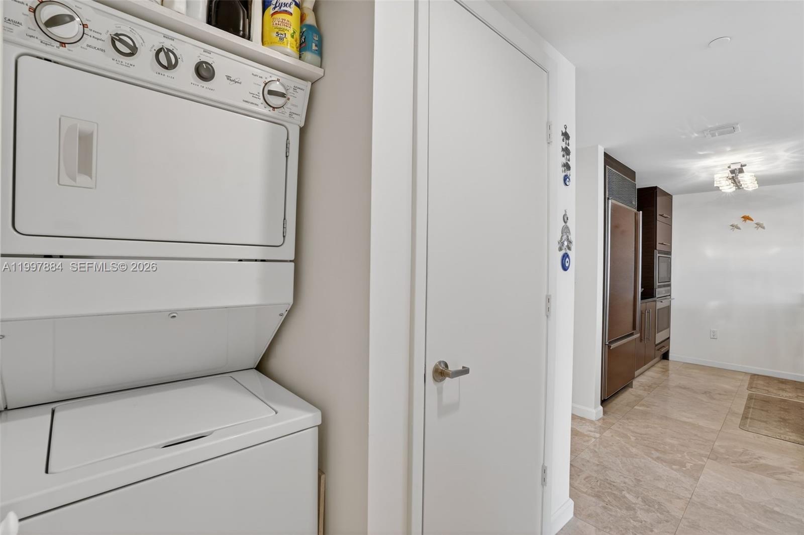 495 Brickell Avenue, Unit 2807 Miami, FL 33131 - Photo 19 of 23 a view of storage and utility room with washer and dryer