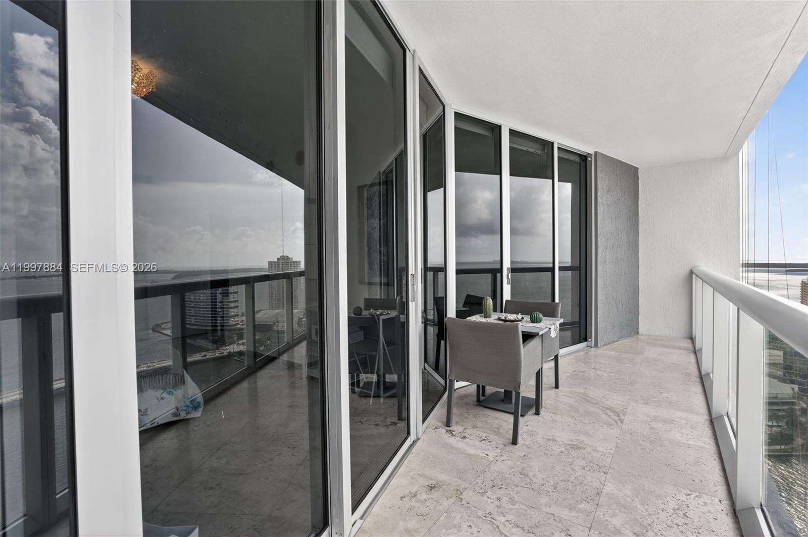 495 Brickell Avenue, Unit 2807 Miami, FL 33131 - Photo 21 of 23 a view of a hallway with furniture and front door