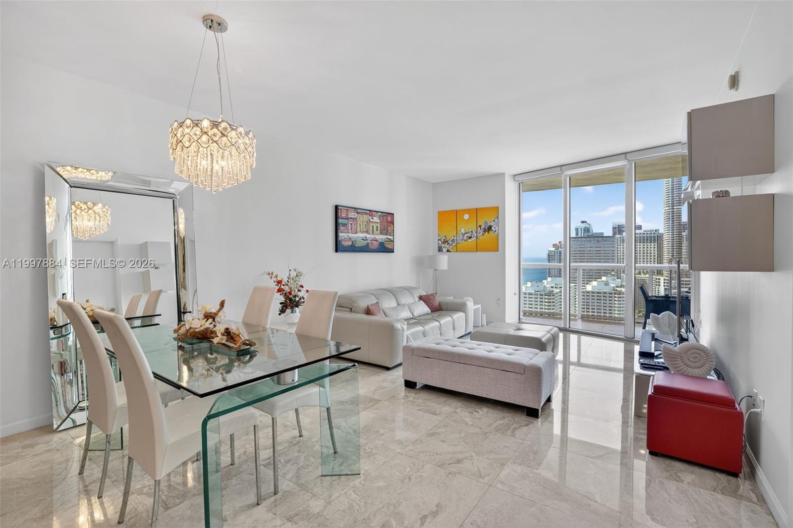 495 Brickell Avenue, Unit 2807 Miami, FL 33131 - Photo 7 of 23 a living room with furniture and a table
