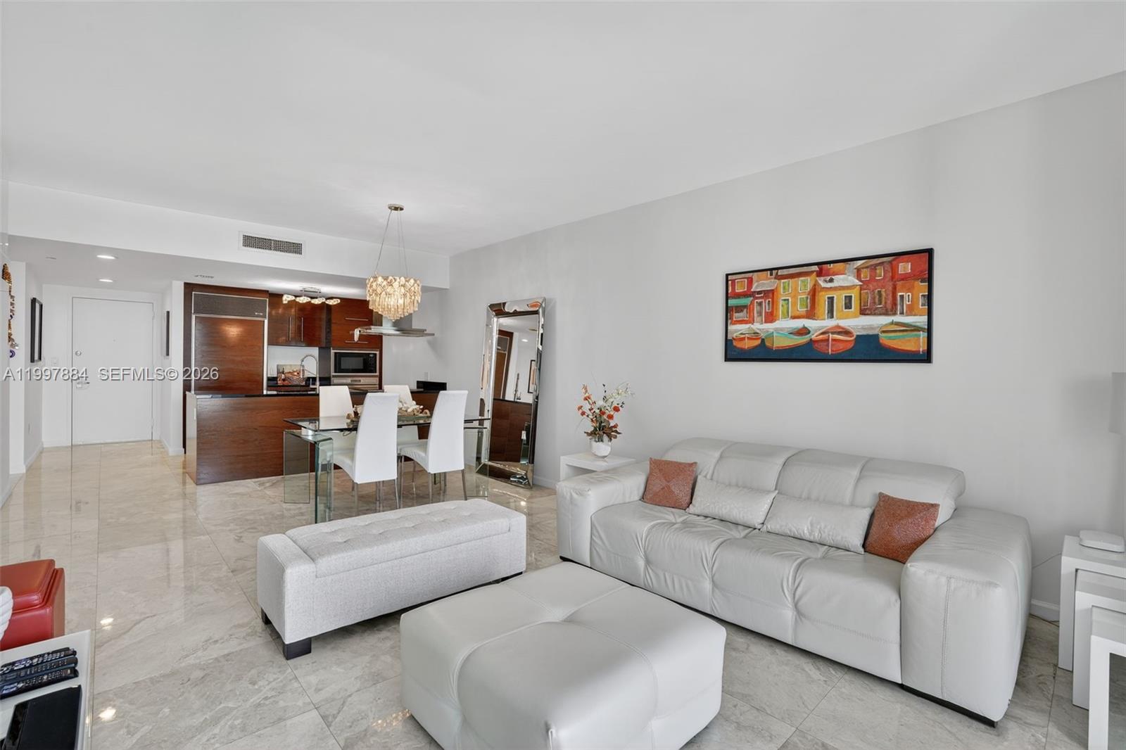 495 Brickell Avenue, Unit 2807 Miami, FL 33131 - Photo 8 of 23 a living room with furniture and kitchen view