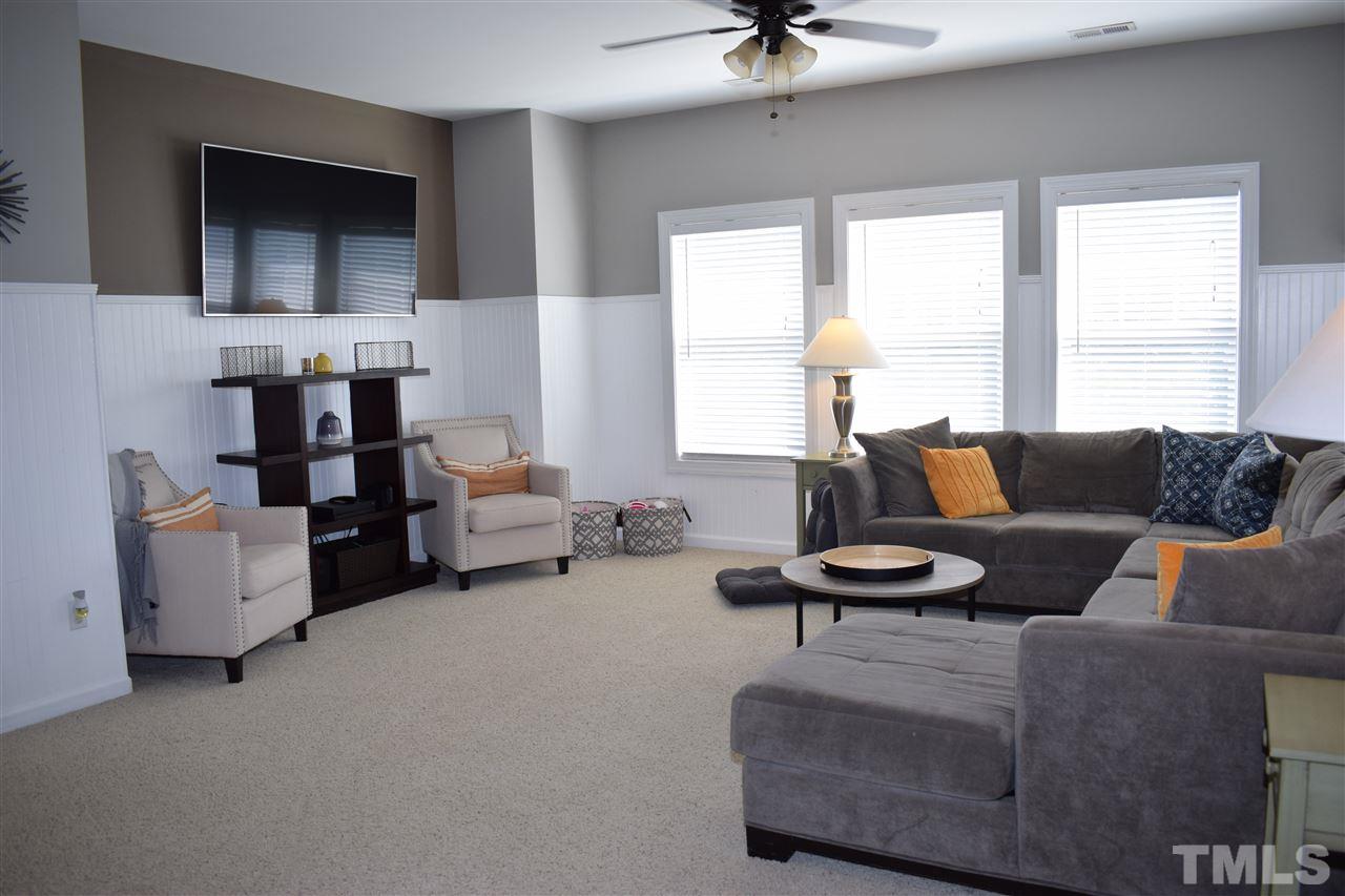 10108 2nd Star Court Raleigh, NC 27613 - Photo 14 of 23 Large loft style bonus room with beadboard.