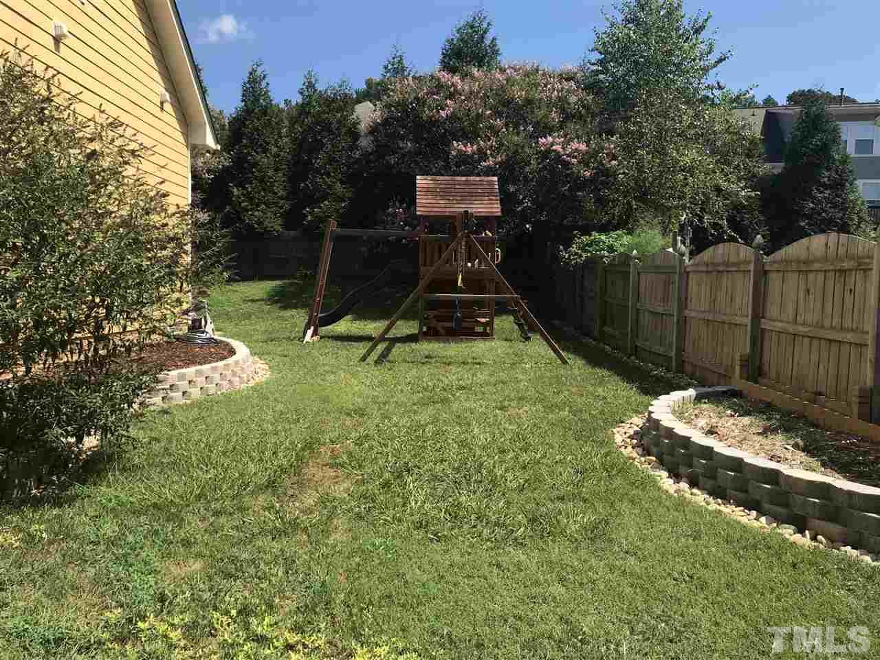 10108 2nd Star Court Raleigh, NC 27613 - Photo 22 of 23 Swingset installed in 2017 conveys.