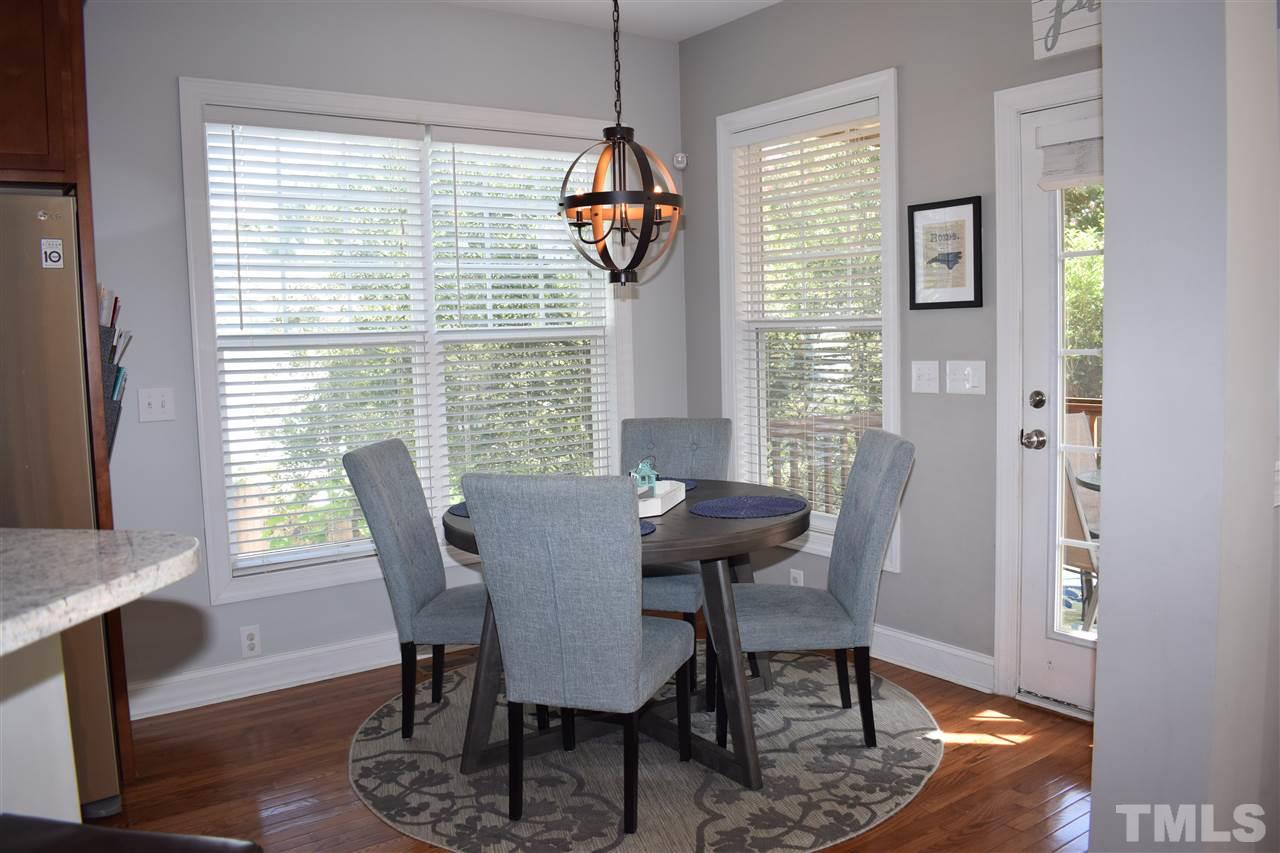 10108 2nd Star Court Raleigh, NC 27613 - Photo 7 of 23 Eat-in-kitchen looks out onto screened porch.