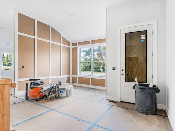 a view of a livingroom with furniture and a window
